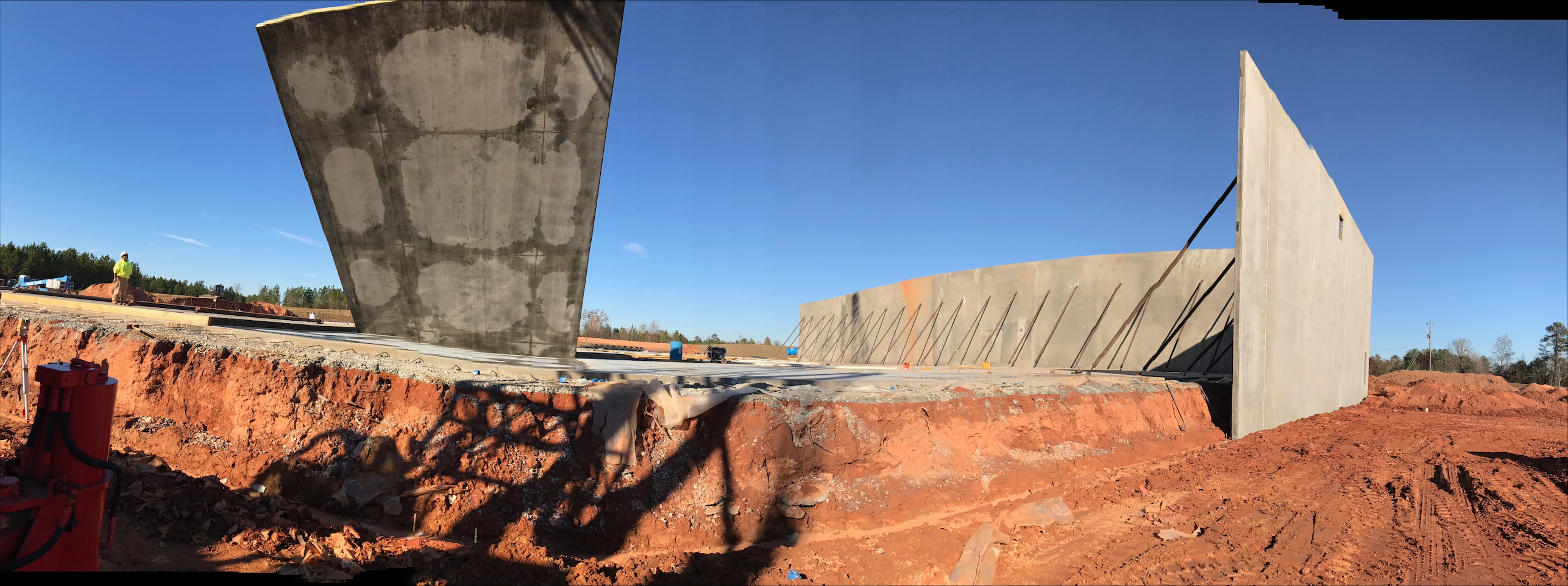 Tilt-up concrete wall panels being set on a commercial jobsite